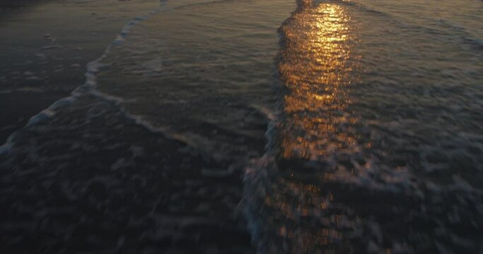 waves beach flyover aerial sunset 4k