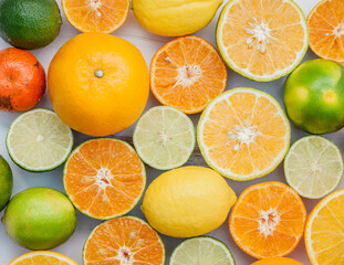 Citrus background. Assorted fresh citrus fruits. Lemon, orange lime,mandarin. Fresh and colorful concept. Top view