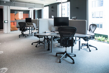 modern office space cubicals workstations desks chairs window city pods teams flexible