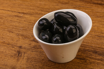 Pickled black olives in the bowl