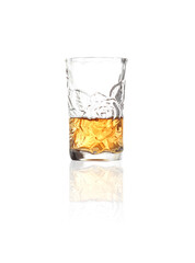 whiskey in shot glass on white background