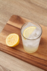 lemonade in glass on wooden tray