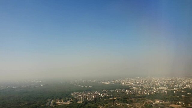 Delhi view, top angle of hills snow and mountains. Sky looks blue covered with clouds.