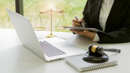 Office attorney advisor with judge hammer and justice scales plus attorney concept laptop and legal...