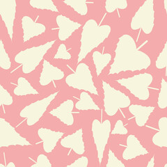 Seamless pattern with light yellow serrate cordate leaves on a pink background. Vector, eps 10.