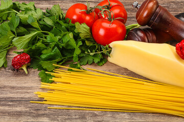 Raw Italian spaghetti heap with cheese