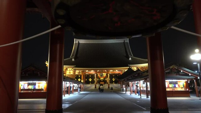 Beautiful reveal of Senso-ji shrine at night with few tourists