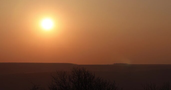 Time lapse of the beautiful sunset by the hill