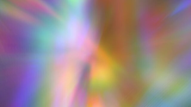 A beam of iridescent rainbow neon purple and bright acid rays of light through a prism. Chromatic aberration. Abstract blurred multicolored background