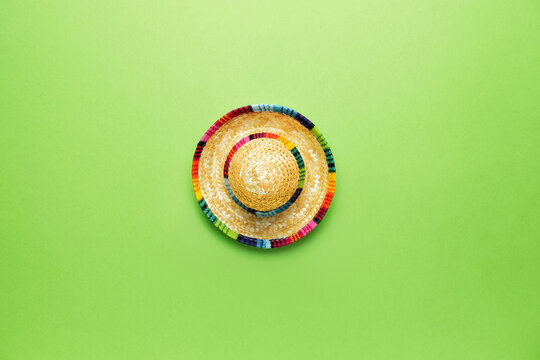 Mexican sombrero on color background
