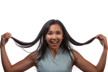 Lifestyle, emotions and happiness concept - cheerful beautiful asian woman pulling her long hair isolated over white background