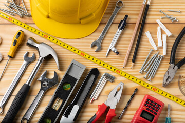 All tools supplies home construction on the wooden table background. Building tool repair...