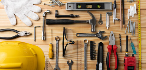 All tools supplies home construction on the wooden table background. Building tool repair...