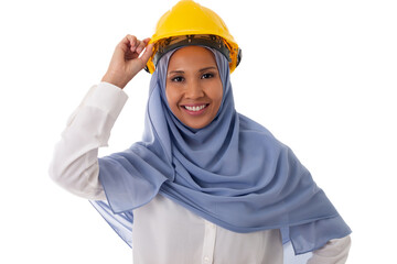 Portrait of asian muslim smiling woman engineer in blue hijab holding yellow helmet, isolated over white background