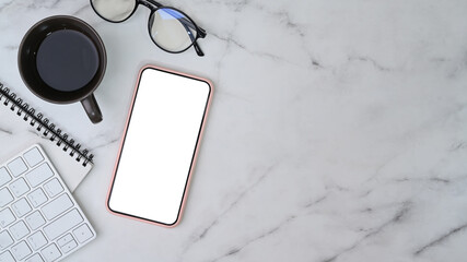 Mock up smart phone, glasses, notebook, coffee cup and copy space on marble table.