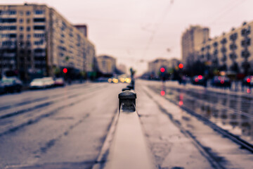 Rainy day in the big city, the empty road. Close up view, from the handrail on the sidewalk level