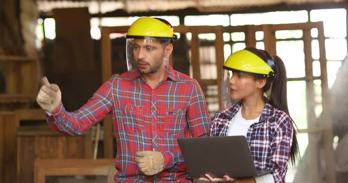 Hispanic Man And Asian Woman Who Has The Ability In Carpentry To Make Woodwork For Home Use. Construction Industry Concept.