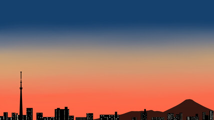 富士山とスカイツリーの見える夕暮れの街並み