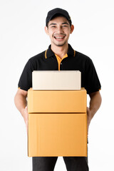 Cheerful Asian delivery man holds package in both hands, smile to camera. Studio medium shot portrait of courier guy in black uniform on isolated white background. E-commerce business concept.