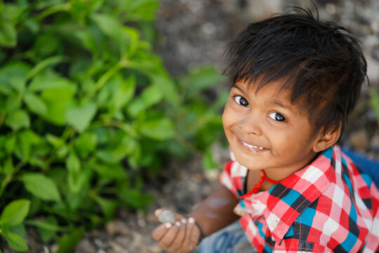 indian poor child playing at home