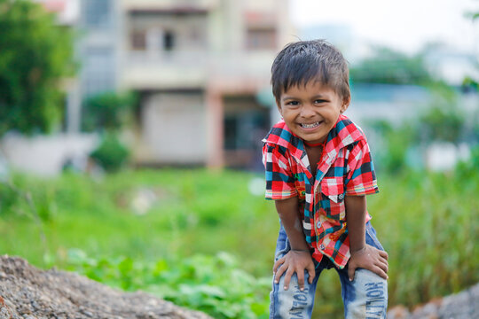 indian poor child playing at home