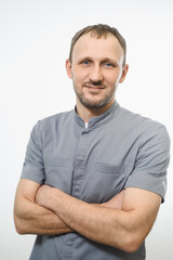 Obraz premium Portrait of friendly gray doctor in grey robe isolated over white background