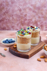 Layered trifle dessert in serving glasses.