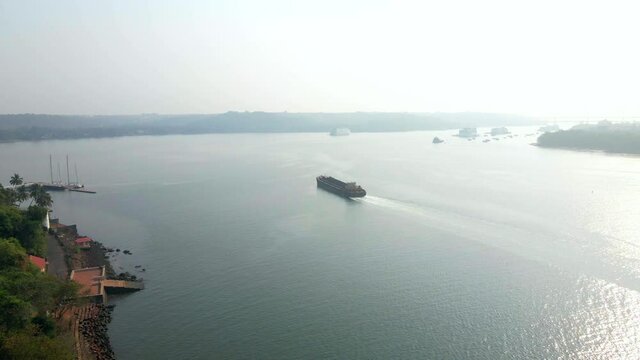 sand ship cargo crossing Mandvi river goa India Panaji Panajim drone flying close by