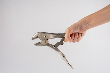 Hand holding locking pliers isolated on white background