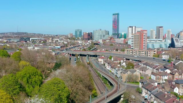 Drone shot towards central croydon national rail train passing through