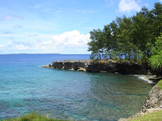Beautiful coast and crystal clear waters of Angaur, Palau.