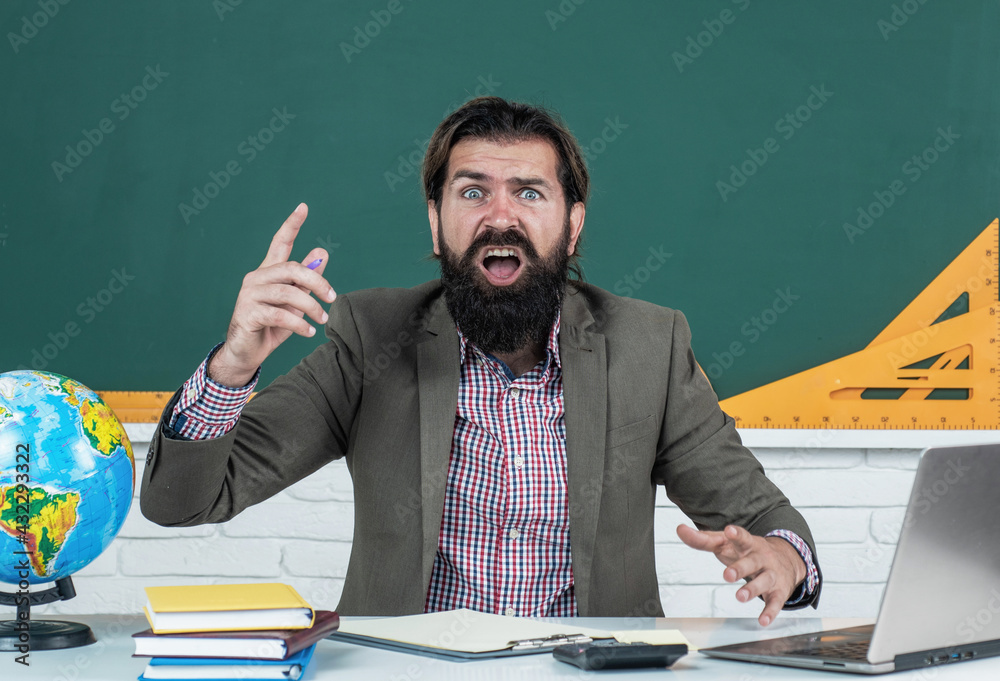 Wall mural shocked and surprised bearded male teacher in university has educational problems, school study