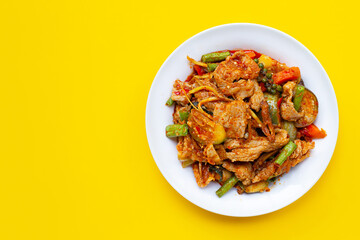Thai food, Hot and spicy stir-fried pork with herbs in white plate