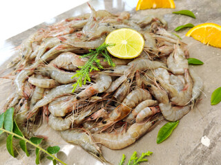 Fresh White Prawns decorated with herbs and fruits.Selective focus.