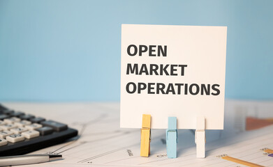 OPEN MARKET OPERATIONS. Finances and business concept. Financial reports and calculator.
