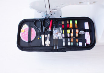 Processes of sewing on the sewing machine. Sewing kit.