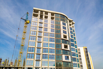 Fototapeta premium High residential apartment building under construction. Real estate development.