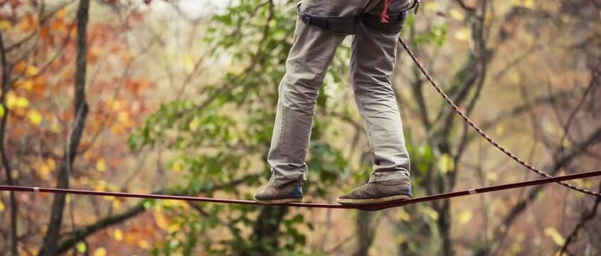 guy balancing on highline slack line