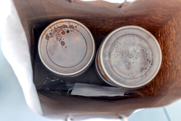 Packed meals for lunch in paper bag. Restaurants and dining halls are closed due to the pandemic.