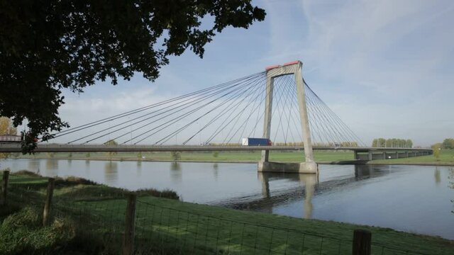 bridge over the river by Heusden