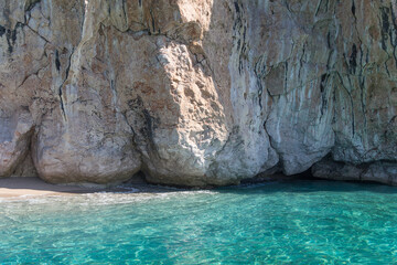 Amazing turquoise sea, piece of wild beach and white rocks, Albania. Travel theme, beautiful nature