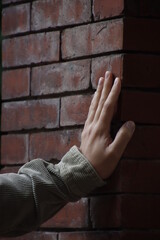 Male hand on a wall