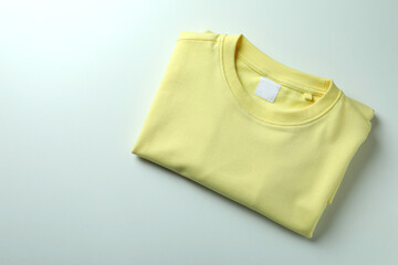 Yellow sweatshirt on white background, space for text
