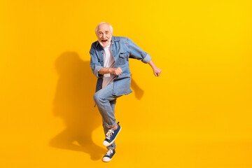 Fototapeta na wymiar Full length photo of hooray funny grey beard old man dance wear shirt isolated on orange background