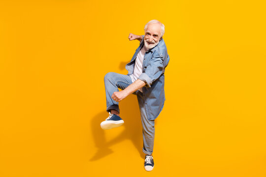 Full Size Portrait Of Excited Cheerful Person Dancing Make Moves Beaming Smile Isolated On Yellow Color Background