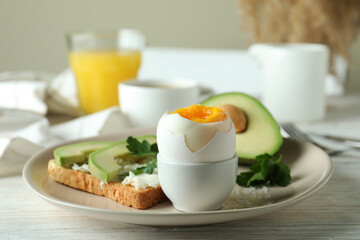 Concept of tasty breakfast with boiled egg, close up