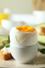 Concept of tasty breakfast with boiled egg, close up