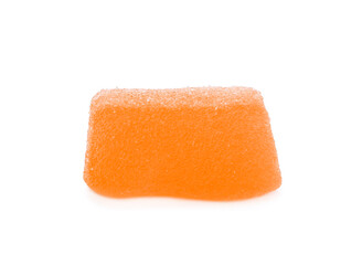 Tasty orange jelly candy isolated on white