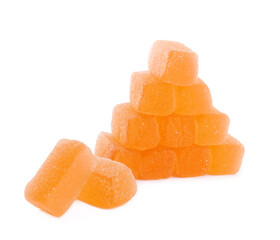 Tasty orange jelly candies on white background