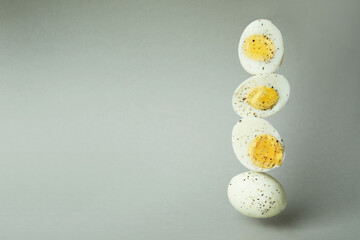 Tasty boiled eggs on gray background, space for text